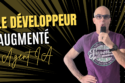 Promotional banner for Le Développeur Augmenté showing a man in a purple shirt holding a microphone on the right with bold gold and white text on a black and gold burst background